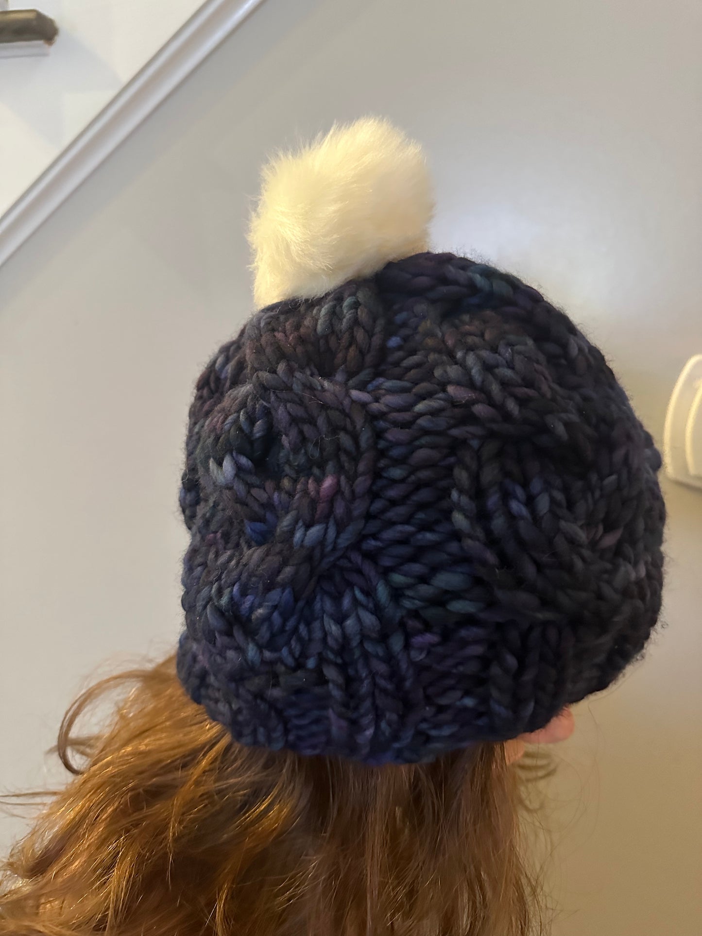 Midnight Frost: Cable Knit Hat with Variagated Blue and White Pom-Pom