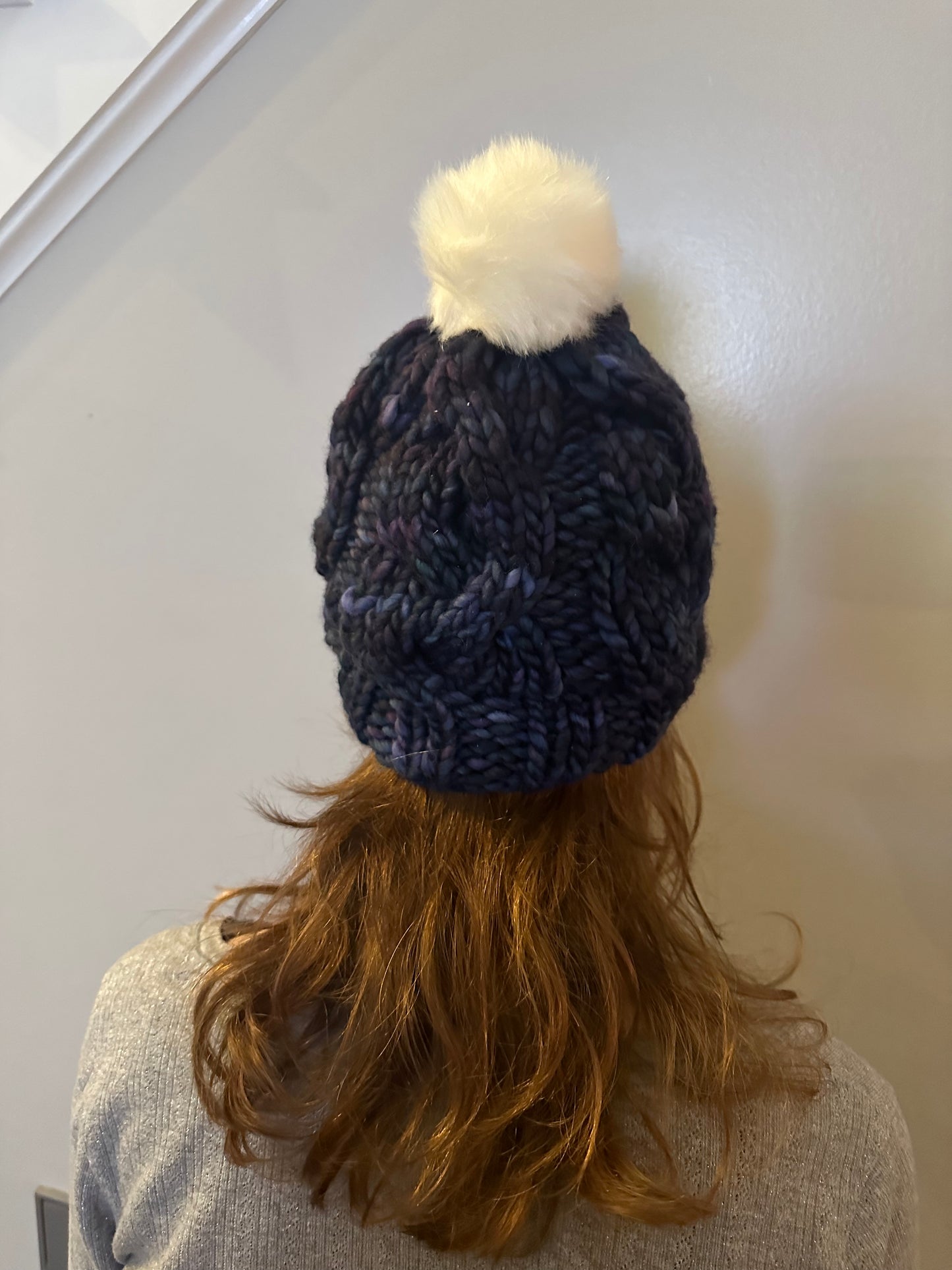 Midnight Frost: Cable Knit Hat with Variagated Blue and White Pom-Pom